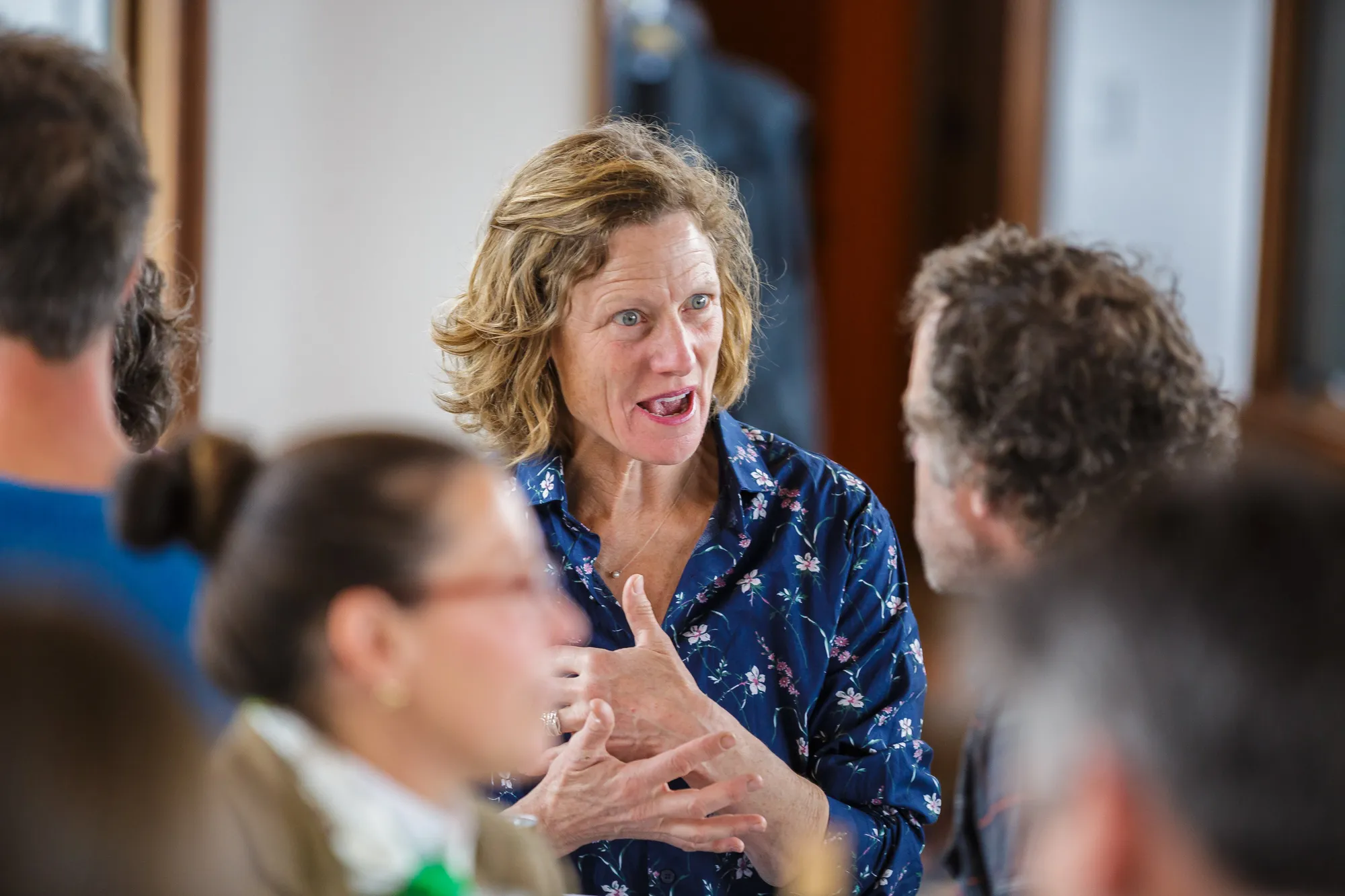 A circle of attendees mid-discussion