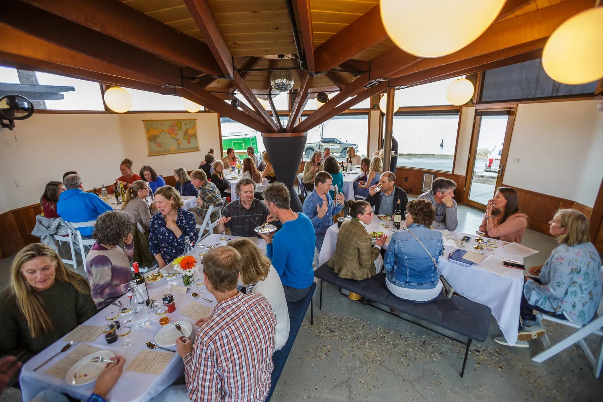 Guests gathered around the table at a Discussion Dinner, May 2022